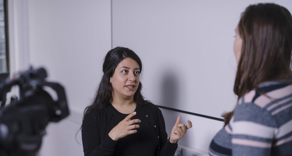woman giving interview/speaking to camera